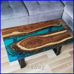 Custom dining table made of walnut wood and blue resin, unique and contemporary